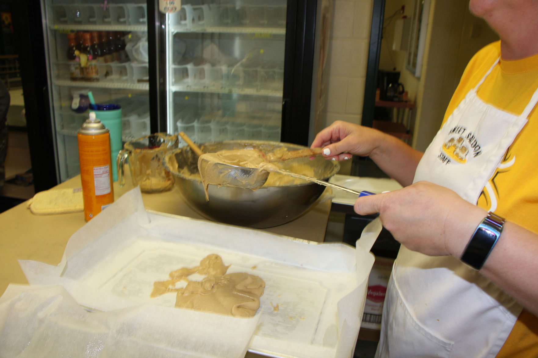 Dough being scooped into the pan